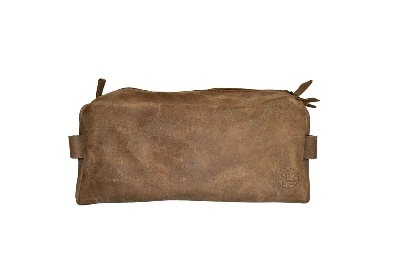 Genuine leather toiletry bag Stylish organization Handcrafted in Honduras 100% genuine leather Zipper closure with braided pull Convenient handle Quality and durability Secure storage (Stone)